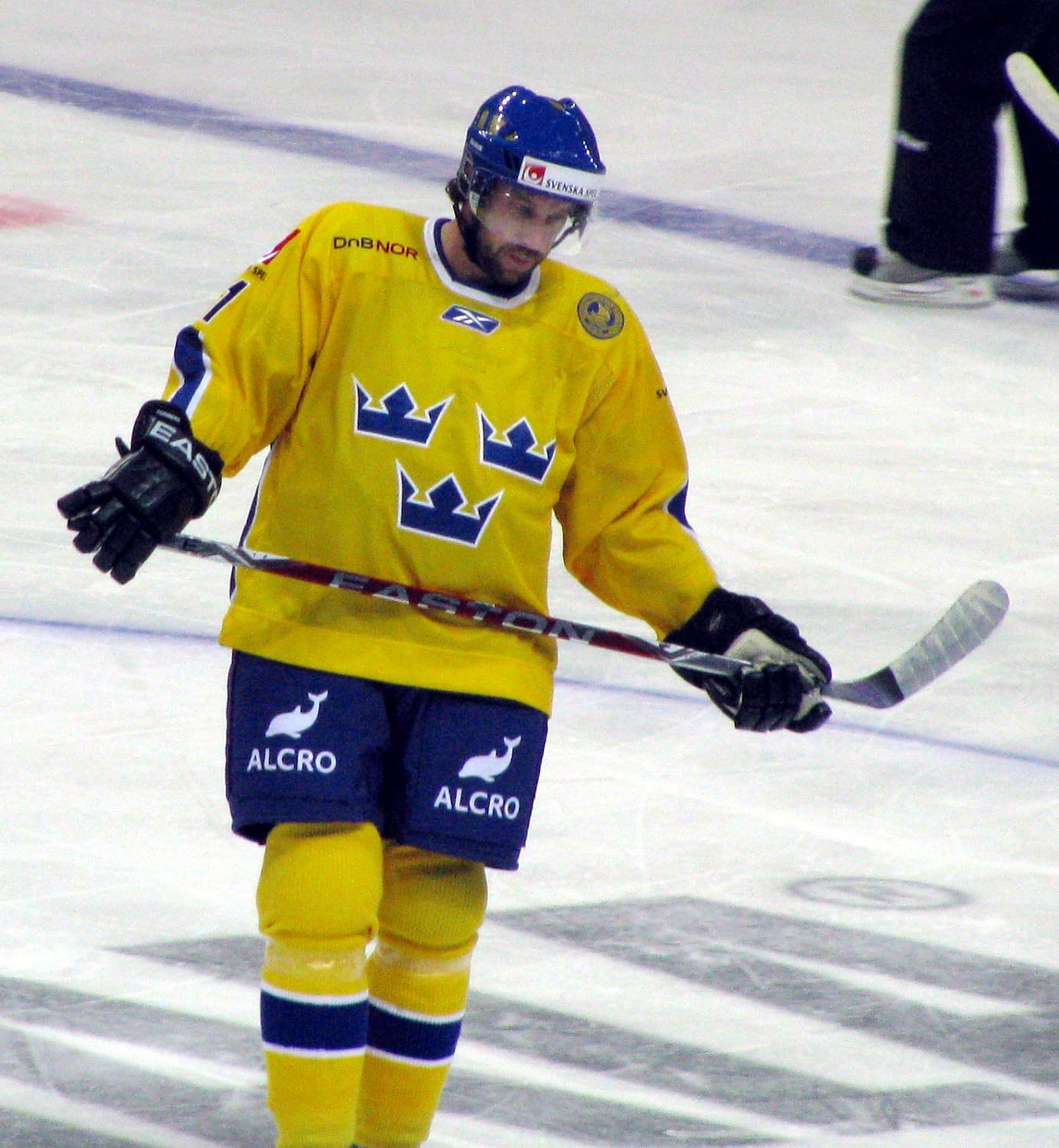 Peter Forsberg looks down while playing for Sweden against Finland.