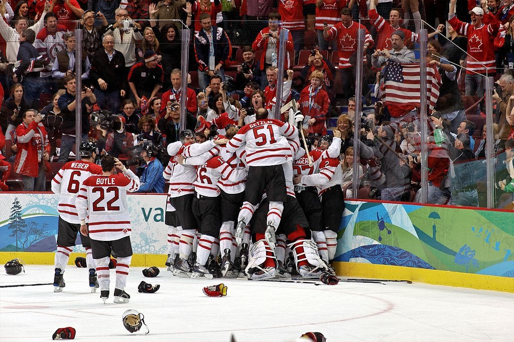 Team Canada celebrates its Olympic gold medal winning goal